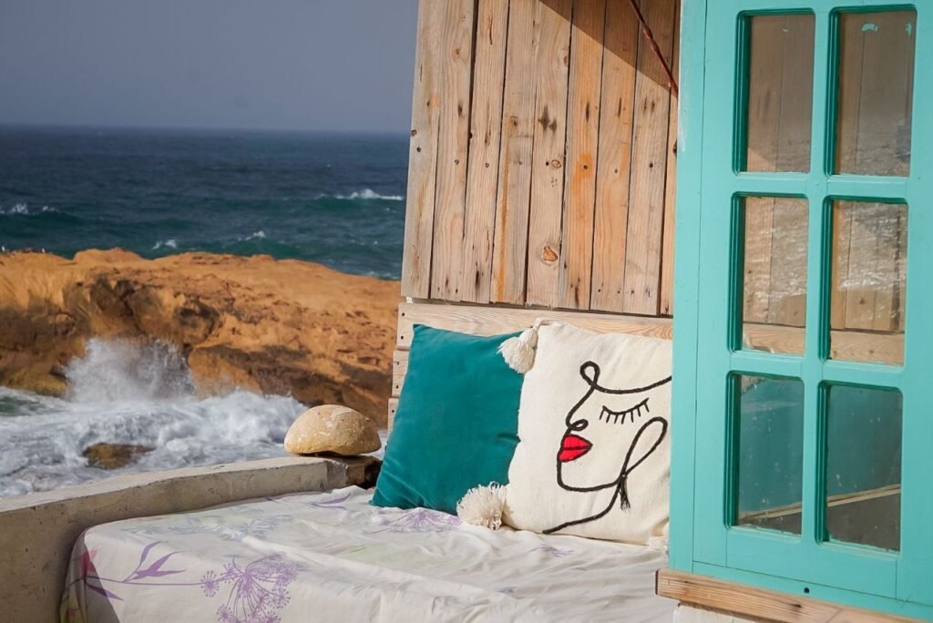 Tadinga room ocean-view terrace at Ajarif Fisherman Cabin, Tamri, Morocco.
