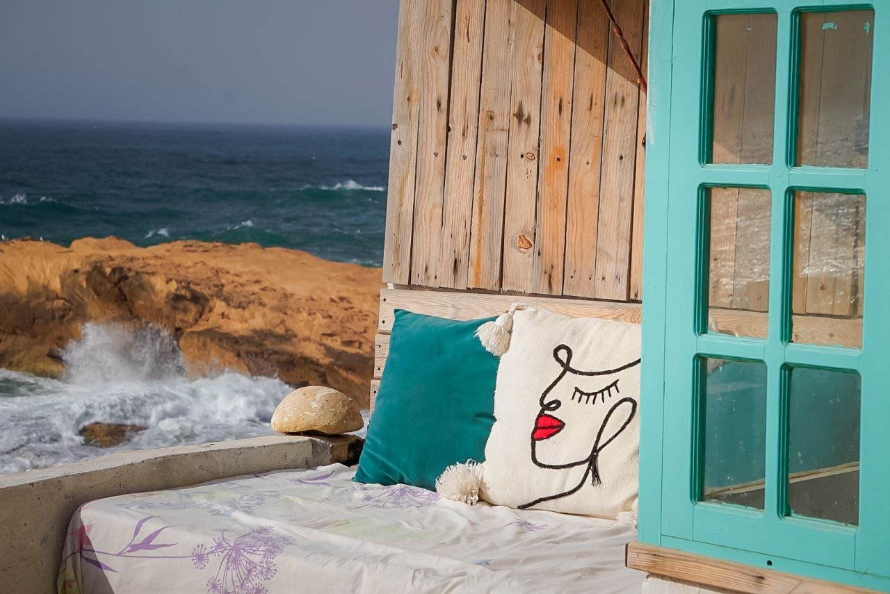 Tadinga room ocean-view terrace at Ajarif Fisherman Cabin, Tamri, Morocco.